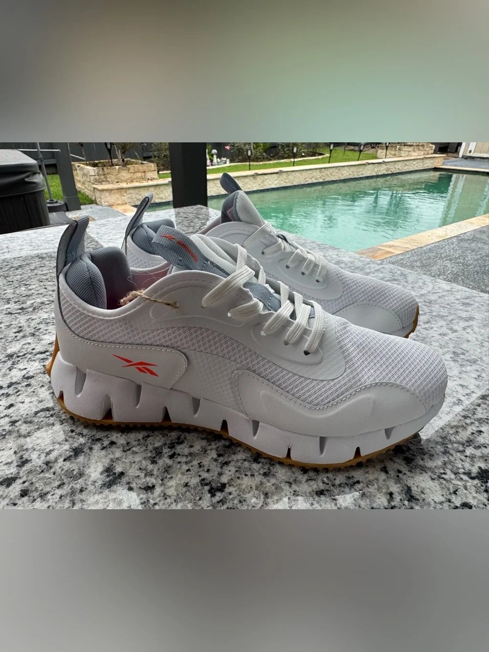 Reebok White and Gray Trail Runner with Orange Logo Accent